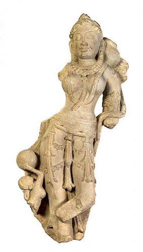 A Carved Sandstone Figural Group of Devi and Attendant, Rajasthan Height 36 inches.