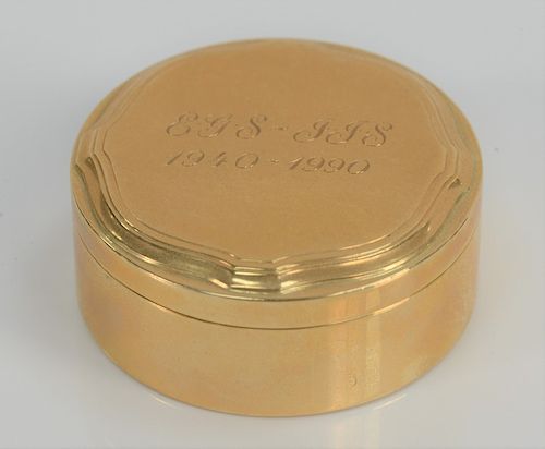 Tiffany & Co. 14 karat gold round box, monogrammed: EGS-JJS 1940-1991. 
height 3/4 inch, diameter 1 3/4 inches, 47.8 grams 

Provena...