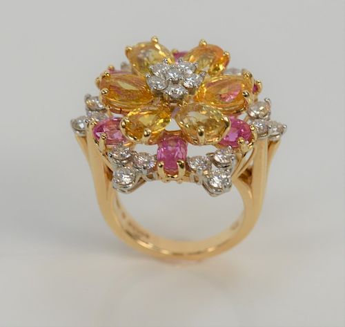 18 karat gold ring, set with diamonds and sapphires having twenty-four round brilliant cut diamonds, six oval yellow sapphires, and ...