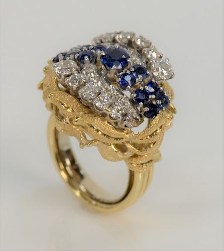 18 karat gold sapphire and diamond ring, set with thirteen blue sapphires, approximately 2 cts., and twenty-two round cut diamonds ...