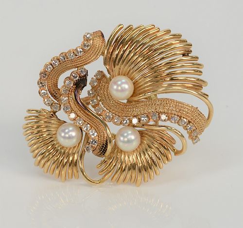 18 karat gold pendant/brooch, set with three pearls and three curved lines of diamonds. 
length 2 1/8 inches, 20 grams total weight