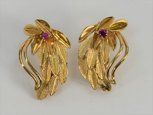Pair of 14 karat gold leaf style ear clips, each set with small red stone, marked: JK. 
11.8 grams.