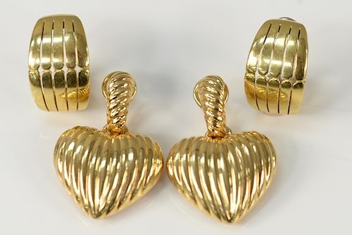Two pairs of earrings to include a pair of 18 karat gold pierced earrings and a pair of 18 karat gold heart shaped earrings with fil...