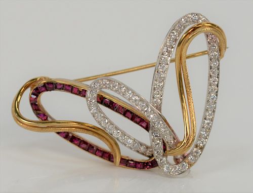 18 karat white and yellow gold brooch, set with diamonds and rubies. 
height 1 1/4 inches, width 2 inches