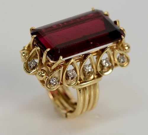 18 karat gold ring, set with rectangular rubellite, surrounded by twelve round brilliant cut diamonds, rubellite approximately 18 ct...