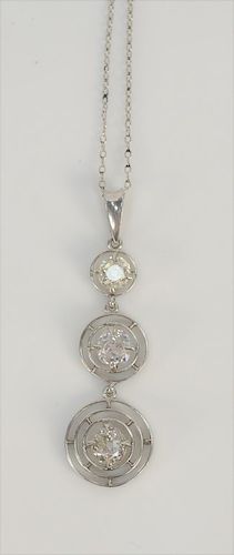 Platinum pendant, set with three diamonds in circles, .48 cts., .45 cts., and .37 cts.
pendant: height 1 3/8 inch