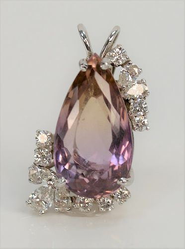 Platinum pendant set with large pear shaped amethyst with five pear shaped diamonds and eight round cut diamonds. 
height 1.25 inches
