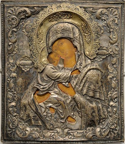 Russian icon, painted with embossed silver oklad with gilt crown, 19th century or earlier with two Christie's stickers on back