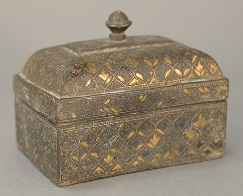 Archaic silver and gold inlaid box, 
rectangle with dome top and finial. 
height 4 inches, width 4 3/4 inches

Provenance: 
Estate o...