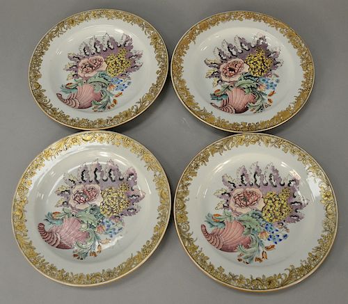Set of four Famille Rose "Cornucopia" plates, 
circa 1730-1740 enameled with large cornucopia of peony, tulip, hydrangea, and clemat...