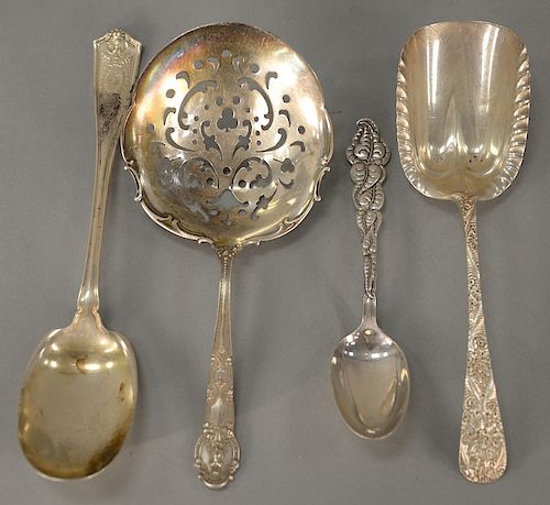 Four Tiffany & Co. sterling silver serving spoons, 
custom engraved, Winthrop pattern, Ailanthus pattern, and Renaissance pattern. 
...