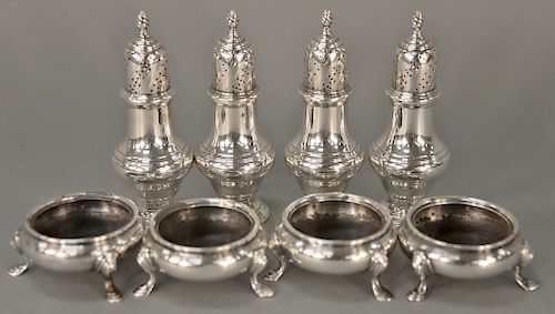 Tiffany & Co. eight piece lot to include four open salts and four pepper shakers. 
salts: height 1 1/4 inches 
pepper shakers: heigh...