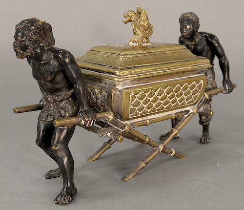 Napoleon III bronze figural box modeled as pair of blackamoors carrying a trunk, barrow, 
on X legs with lift-top and foo bird finia...
