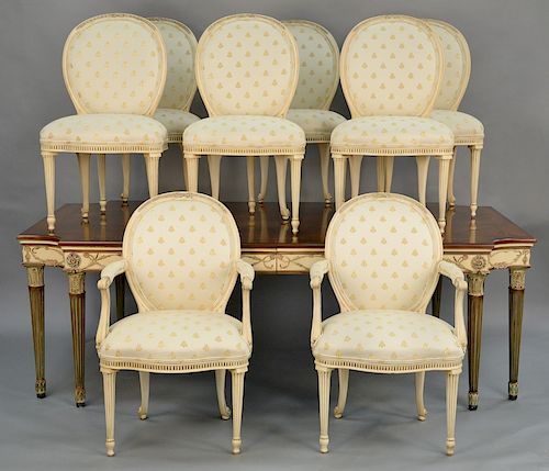 E.J. Victor dining table and eight chairs,  having shaped top on turned and fluted legs, and three dimensional flowers on skirt wi...