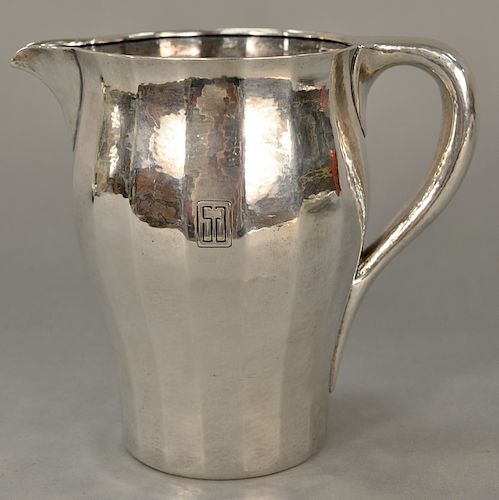 Tiffany & Co. sterling silver hand hammered water pitcher, 
paneled circular form and rolled rim, monogrammed, marked on base: Tiffa...