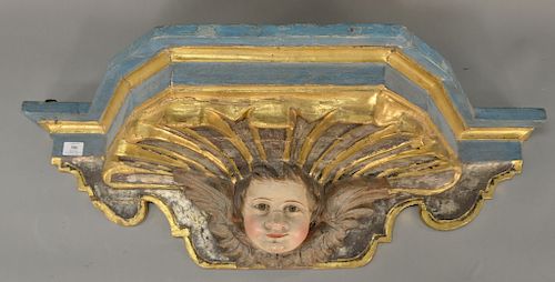 Carved polychrome shelf,  having putti face with gilt highlights.  height 12 inches, width 38 1/2 inches, depth 14 inches