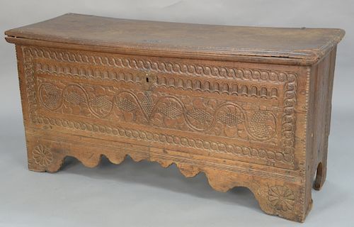 Continental lift-top chest with carved front,  dated 1719, on large bracket feet