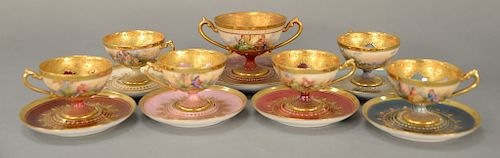 Seven Dresden cups and saucers to include,  set of six demitasse and one with two handles (one small saucer with small chip).  c...