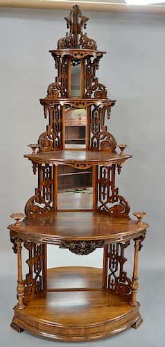 Victorian rosewood corner etagere with pierced carved supports and mirror corners. 
height 93 1/2 inches, width 40 inches, depth 24 ...