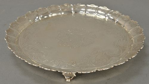 Paul de Lamerie (1688-1751) silver fruit dish having raised scalloped edge with shell and thatched chasing, set on four scrolled fee...