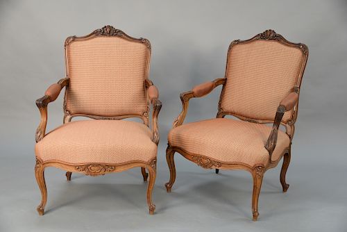Pair of Continental carved rosewood open armchairs,  late 19th/early 20th century with custom upholstery, arms partially upholstered