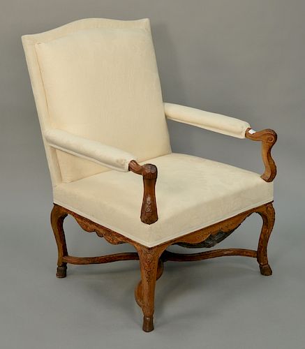 Louis XV fauteuil having off-white walnut frame,  carved hand rests and legs with stretcher base, 18th century.  height 39 1/2 inche...