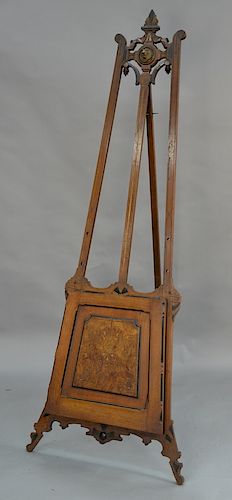 Victorian walnut and burl walnut easel with folio compartment. 
height 83 inches, width 23 1/2 inches

Provenance: 
Estate of Stephe...