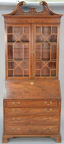 George III mahogany secretary desk in two parts, two glazed doors over drop front desk with leather writing surface over four drawe...