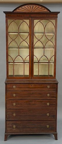 George III mahogany butlers secretary desk with inlaid half round, crest over glazed doors over pull-out desk over three drawers, on...