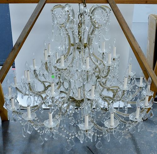 Crystal and brass thirty-seven light chandelier.  height 48 inches, diameter 50 inches