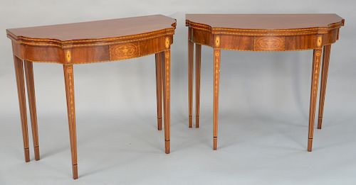 Pair of Fineberg mahogany shaped top game tables, 
on conforming frieze with drawers, set on square tapered legs with urn, panel, li...