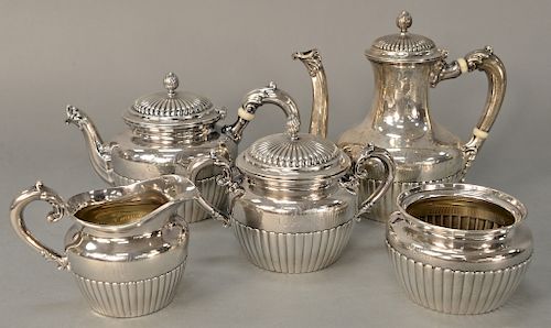 Sterling silver five piece tea and coffee set, 
with ribbed body and covers. 
tallest teapot: height 7 1/2 inches 
64.6 troy ounces