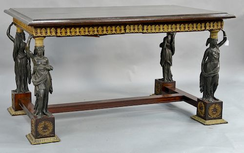 Classical French Empire style writing table,  two drawers on two pairs of bronze caryatids mounted on square mahogany bases with gil...