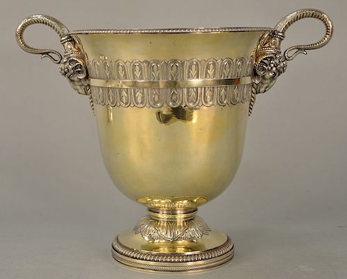 Benjamin Smith silver gilt wine cooler having snake style handles with large ram heads and band surround over oval chased leaves on ...