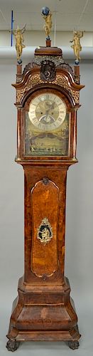 Dutch walnut tall clock having domed top, with three figural finials and shell carvings with shaped door, bronze figure over glass ...