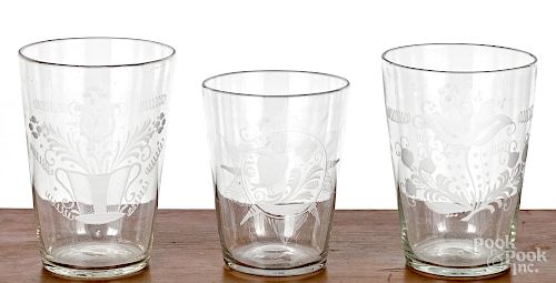Three large etched colorless glass flips