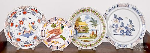 Four Delft polychrome chargers and plates