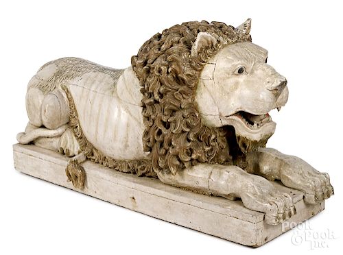 Large carved and painted recumbent lion