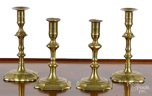 Two pairs of English Queen Anne brass candlesticks