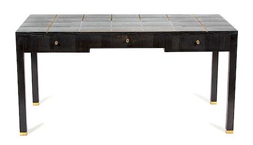A Contemporary Bronze Inlaid Ebonized Writing Desk Height 30 x width 48 x depth 28 inches.
