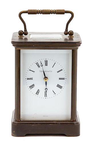 An American Brass Carriage Clock Height 5 1/2 x width 4 x depth 3 1/2 inches.