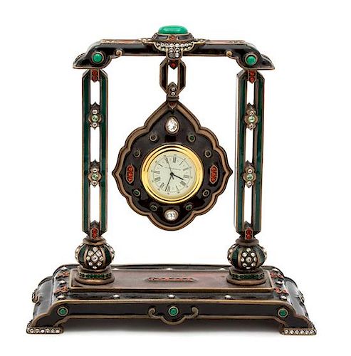 An American Enamel and Brass Desk Clock Height 7 x width 6 1/2 x depth 3 inches.