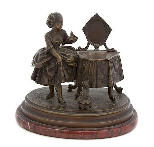 A French Bronze Figural Inkwell Height 5 1/2 x width 6 x depth 4 inches.