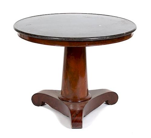 A Napoleon III Mahogany Marble Top Table Height 29 x diameter 38 1/4 inches.