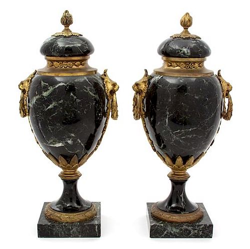 A Pair of French Black Marble Urns with Gilt Metal Mounts Height 16 1/2 x diameter 6 inches.