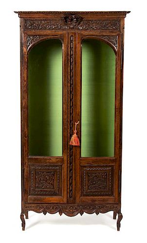 A French Provincial Style Carved Oak Display Cabinet Height 68 x width 34 1/2 x depth 13 inches.