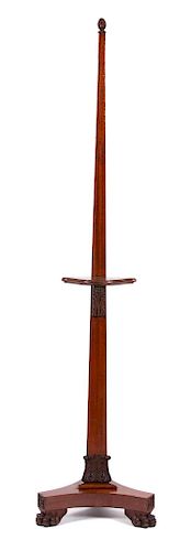A Regency Carved Mahogany Painting Easel Height 81 x diameter of base 18 inches.