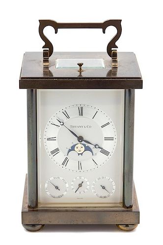 An American Carriage Clock Height 5 1/2 x width 4 x depth 3 1/2 inches.