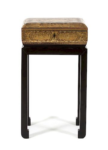 A Chinoiserie Brown and Gilt Lacquered Sewing Box on Stand Height overall 22 x width 12 x depth 10 inches.