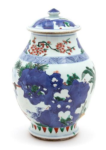 A Chinese Wucai Porcelain Covered Jar Height 10 x diameter 6 inches.